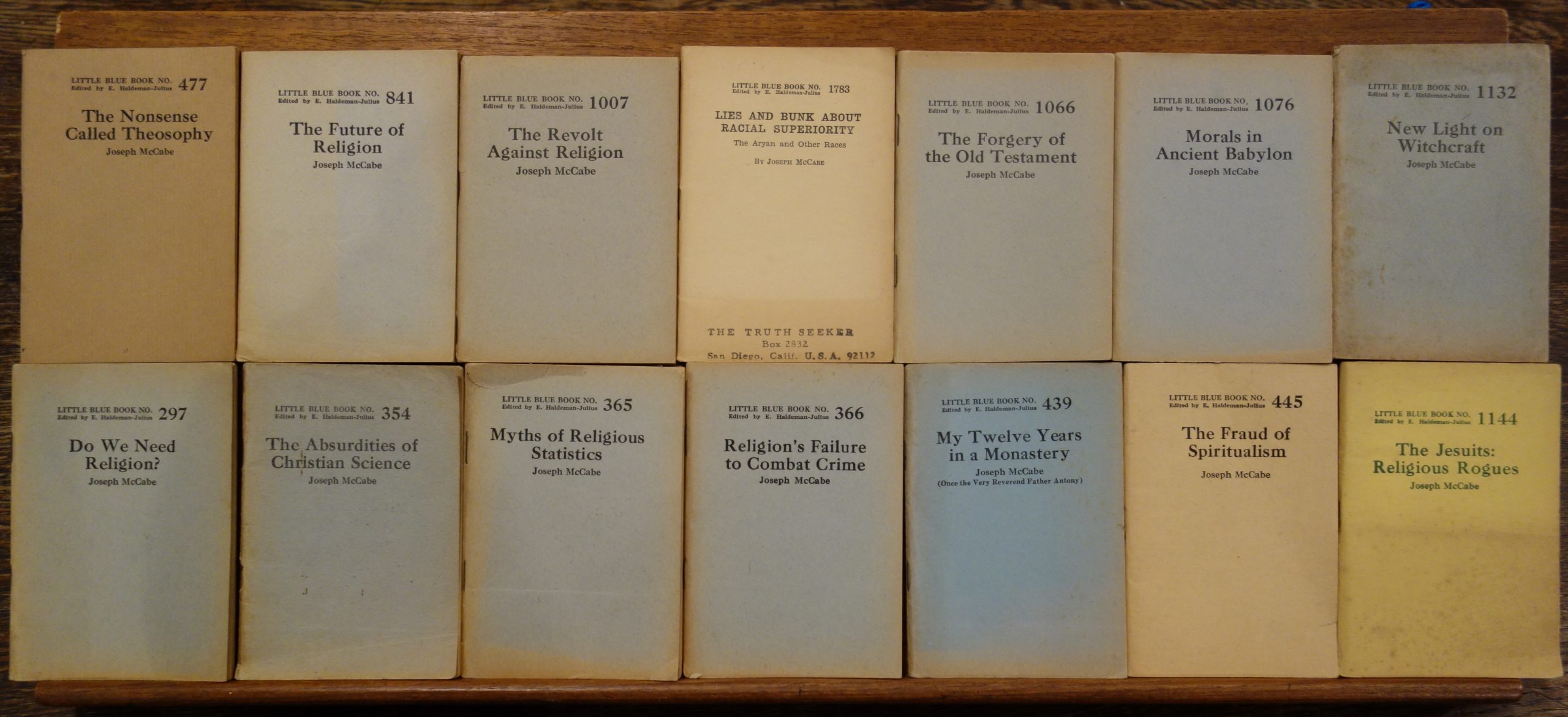 A colour photograph of a selection of Little Blue Books By Joseph McCabe